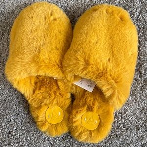 Slippers. Mustard fuzzy slip-on.